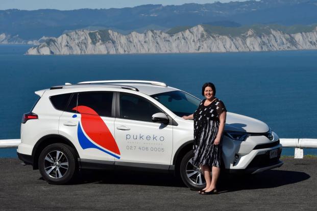 Anna Lovett with her Pukeko Rental Managers Car